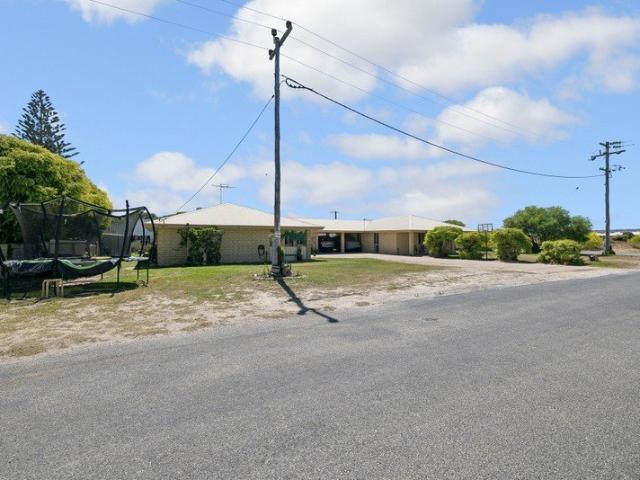 A RARE COASTAL OPPORTUNITY WITH TWO HOMES ON ONE TITLE