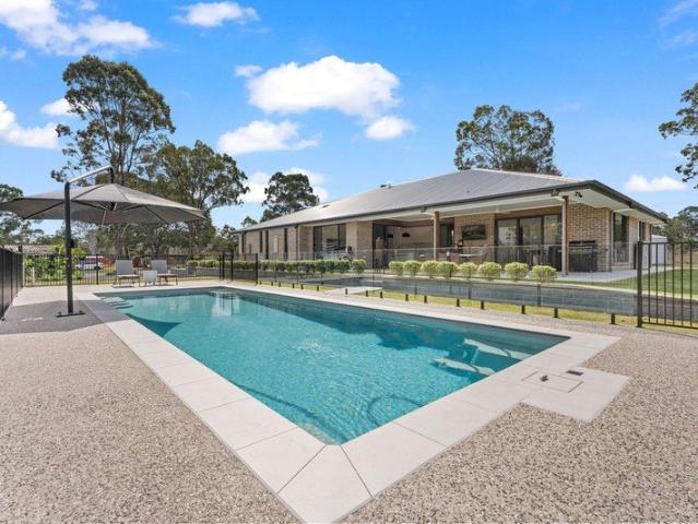 A Rare Acreage Offering Near New Luxury, Pool, Shed and Space for Every Generation