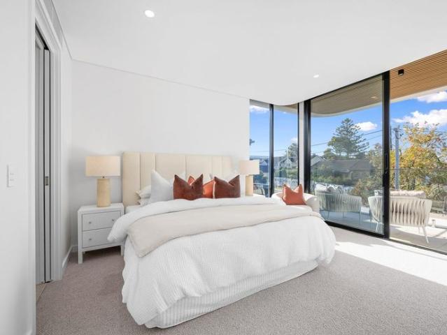 A Rare Bayside Masterpiece with an Exclusive Private 6 Car Garage