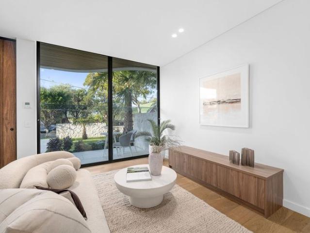 A Rare Bayside Masterpiece with an Exclusive Private 6 Car Garage