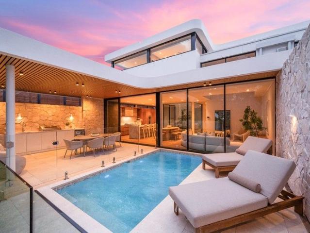 A Rare Bayside Masterpiece with an Exclusive Private 6 Car Garage