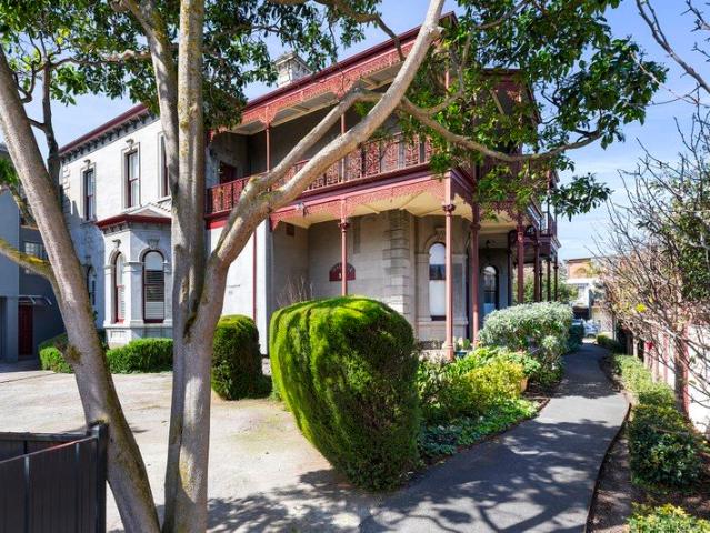 A Rare Beachside Treasure with Bay Views