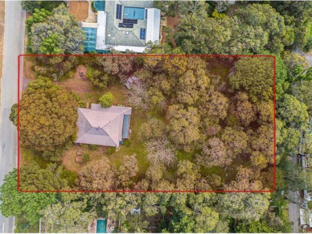 A rare Glen Forrest block made for family life with the school across the road and a backyard waiting to become something wonderful