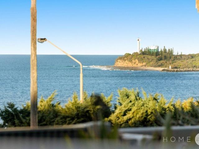 A rare ground floor residence capturing elevated, uninterrupted ocean views