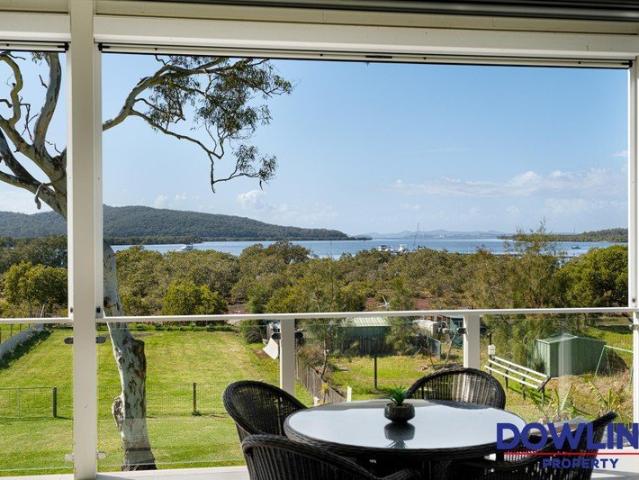 A rare dual occupancy opportunity in Karuah, offering versatile living and unmistaken water views!