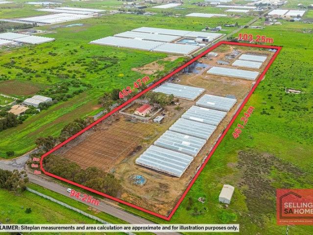 A Rare Opportunity 11.76 Acres with Established Greenhouses + Bolivar Water + Infrastructure + Home