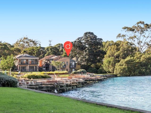 A rare opportunity to secure one of Rhodes' most desirable waterfront townhouses