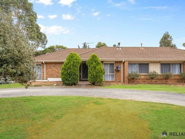 A Rare Lifestyle Acreage Offering with Multiple Residences, Powered Sheds & Endless Possibilities