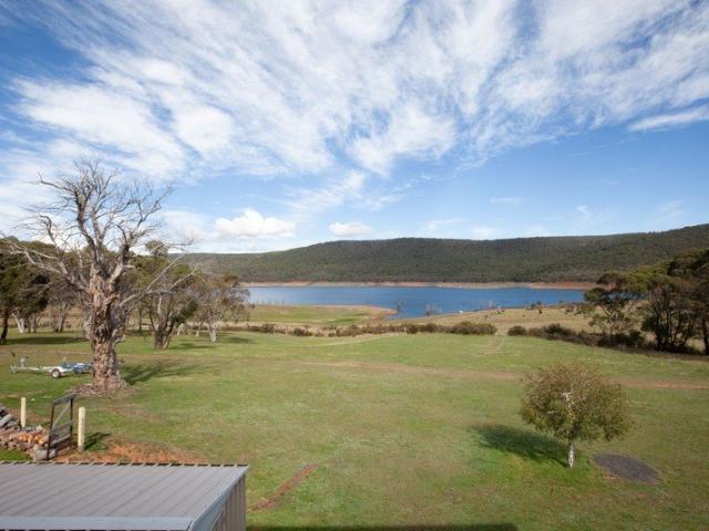 A Rare Turnkey Opportunity Fully Furnished Lakefront Retreat with unrivalled Alpine Access