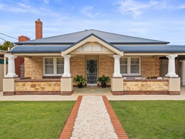 A refined coastal art deco bungalow offering functionality & an exceptional lifestyle