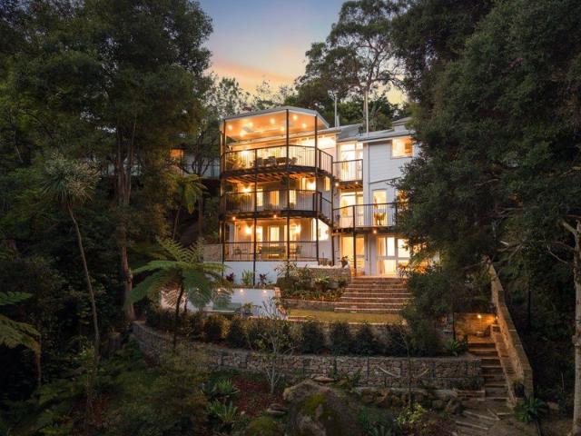 A reinvention of a modernist masterpiece fully renovated waterfront reserve home