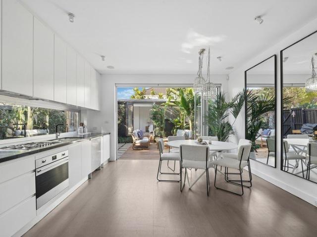 A Relaxed Beachside Haven On A Sunny North Facing Corner Block With Lush Established Tropical Gardens