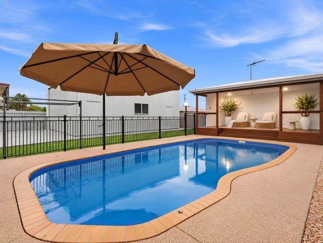 A Renovated Retreat with Poolside Appeal & Room for Everything.