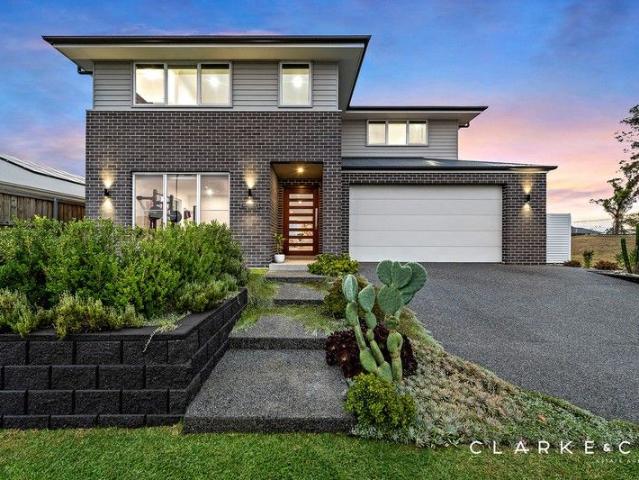 A STATEMENT HOME WITH EXCEPTIONAL FINISHES INSIDE AND OUT!