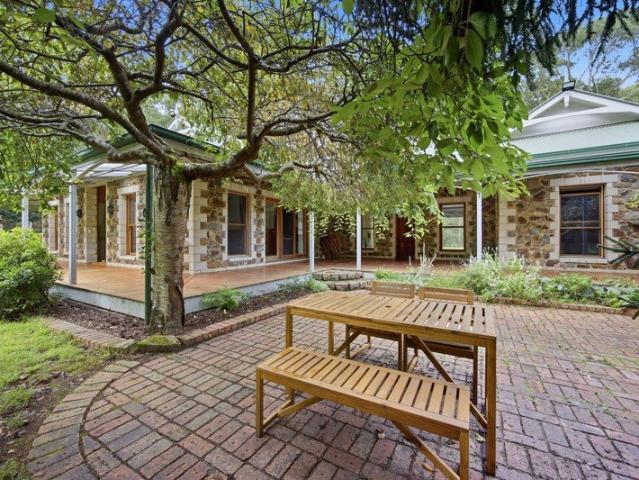 A STONE AND BRICK HOUSE ON THE YARRA RIVER AT REEFTON