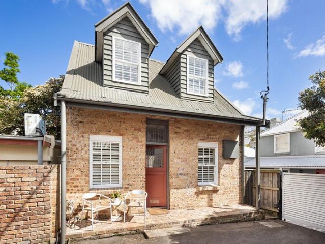 A storybook cottage in the historic village heart