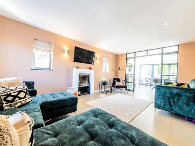 A striking five bedroom detached house with a southerly garden located in a popular village location