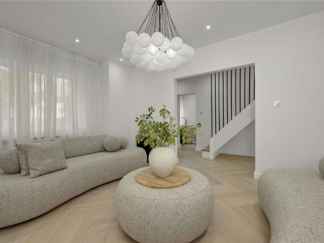 A stylish and contemporary three bedroom home with a private garden in the heart of Esher