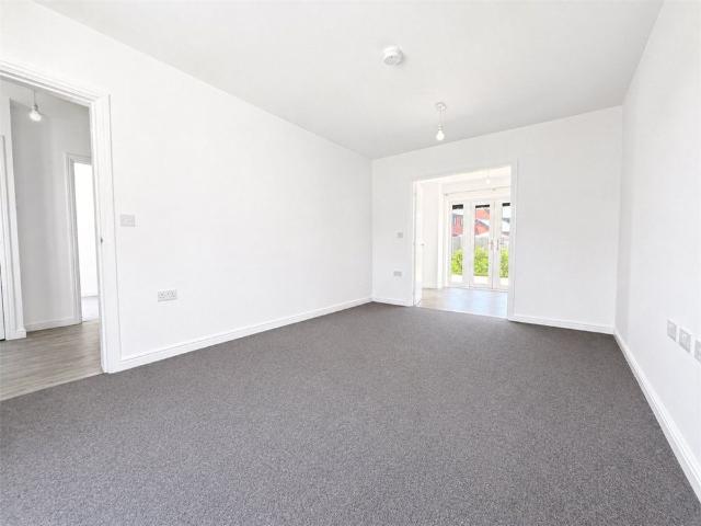 A stylish five bedroom new build home with three bathrooms, a double garage, and parking for four vehicles, set over three spacious floors