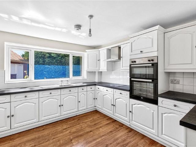 A substantial detached dormer bungalow offering spacious and versatile accommodation, set within generous grounds with gardens to the side and rear