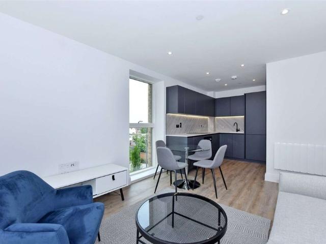 A second floor furnished apartment with south facing private balcony in the sought after Horlicks Artesian House development by Berkeley Homes
