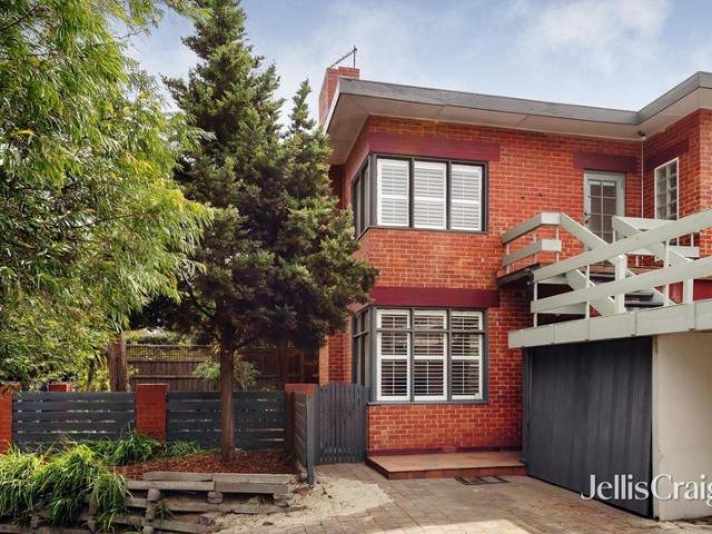 A semi detached house in garden glory