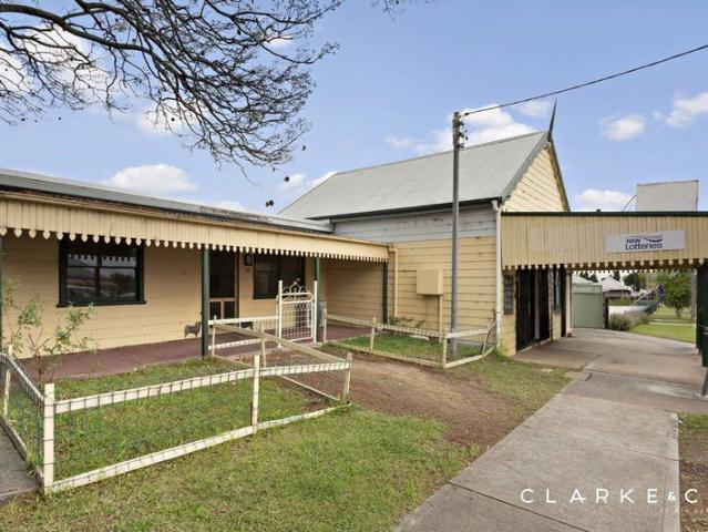 A SHOP, A HOME, & ONE FANTASTIC INVESTMENT OPPORTUNITY!