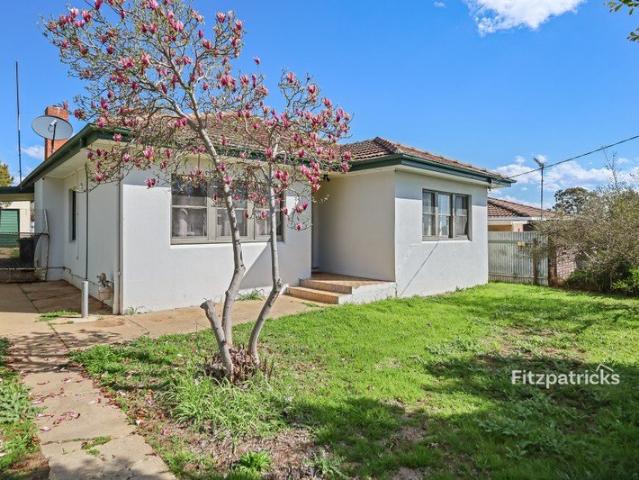 A Solid Home with a Garden Ready for Some Attention