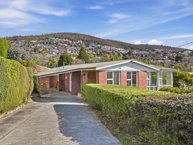 A Solid Sandy Bay Home with Sun, Views and Potential
