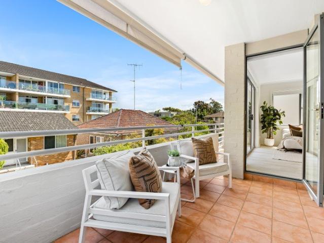 A Spacious Coastal Retreat Move in Ready and only 150m from the Sand!