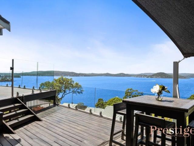A Split Level Masterpiece Embracing 180° Water Views
