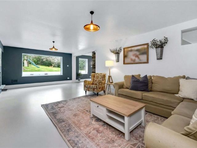 A truly impressive family home in a popular residential road in Esher, offering stylish and modern living with 5 bedrooms, 3 bathrooms and 4 reception areas