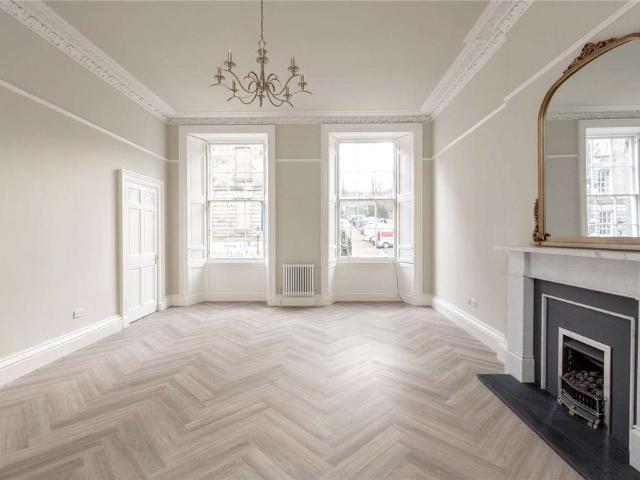 A truly stunning, fully refurbished, three bedroom ground floor apartment, located in Edinburgh New Town