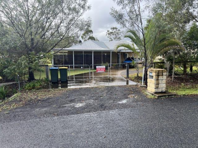 A unique & beautiful 4 bedroom family home with loads of extras in a semi rural location on a large block