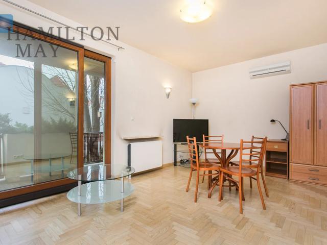 A unique, bright apartment with a large terrace and security