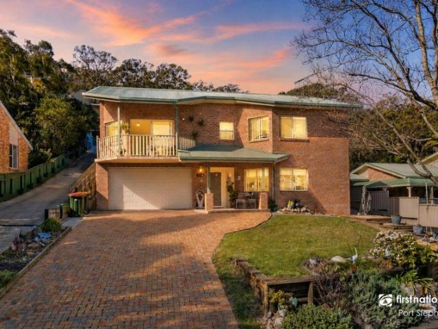 A VERSATILE COASTAL HOME IN NELSON BAY WITH MULTIPLE LIVING ZONES