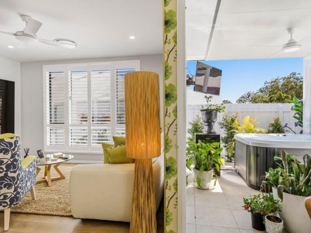 A Villa of Unexpected Indulgence bespoke wallpaper, shutters, Crimsafe, a soaring skylight, dual basins to ensuite, bidet seats & zoned ducted air