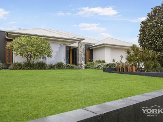 A WARM AND WELCOMING FAMILY HOME WITH ELEVATED APPEAL