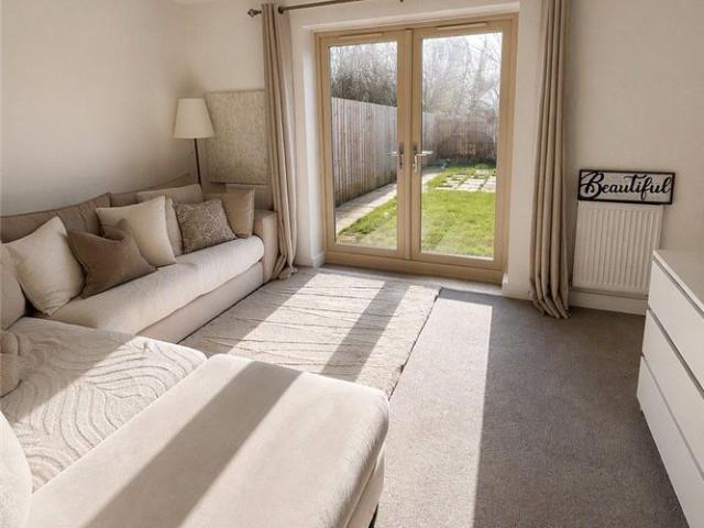A well presented three storey, three bedroom end of terrace property set in a popular development
