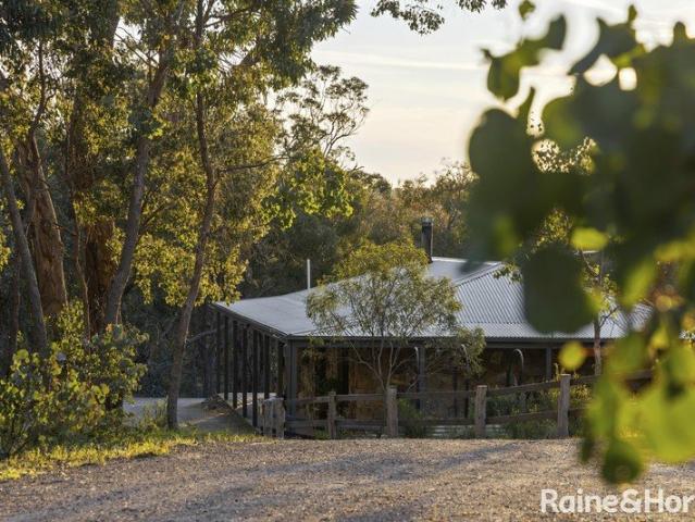 A Woodland Retreat With An Impeccably Handcrafted Stone Home