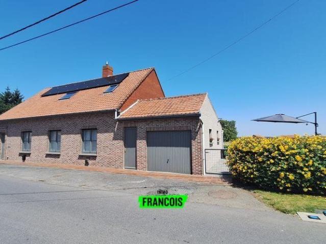 A 3 bedroom house with a garden and garage in a rural setti…