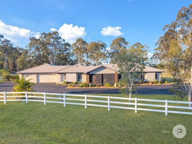 Acreage Oasis with Exceptional Dual Living