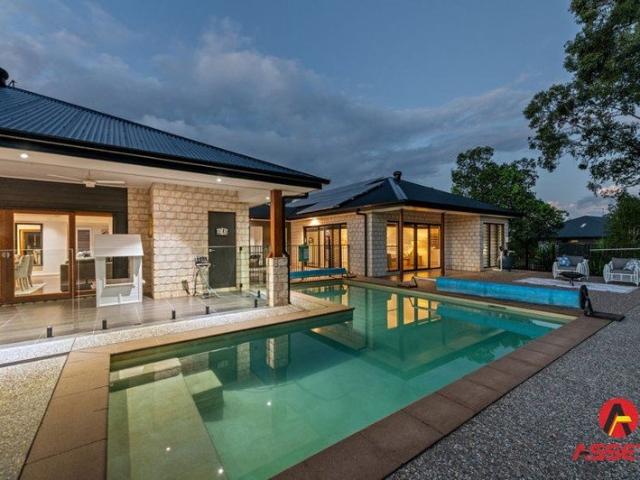 Acreage Lifestyle Without Compromise. 5 Bedroom Custom Built Home with Inground Pool at Prestigious 'Jimboomba Woods Estate '.