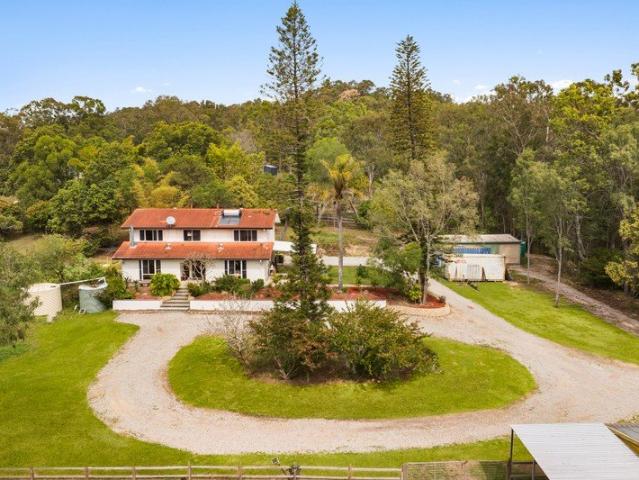 Acreage Living with Endless Potential on 7.5 Acres!