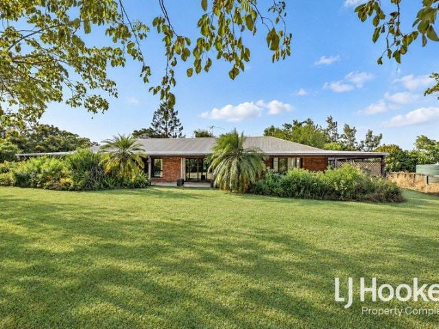 Acreage Living in Exceptional Locale Minutes to Amenities Elevated Position