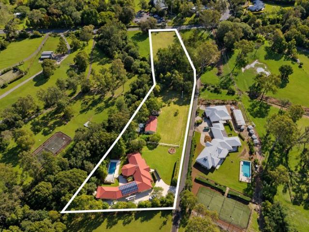 ACREAGE PERFECTION: PRIVATE SANCTUARY WITH DUAL LIVING AND MULTIGENERATIONAL APPEAL