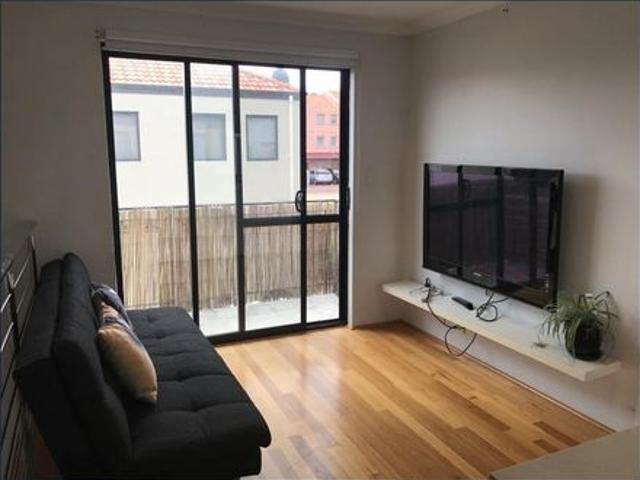 ABOVE GARAGE PARTLY FURNISHED STUDIO WITH GARAGE SPACE!
