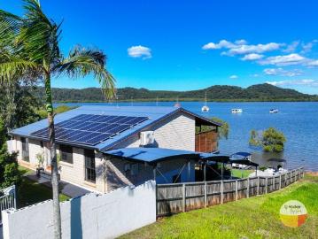 ABSOLUTE WATER FRONT LIVING WITH MILLION DOLLAR VIEWS!