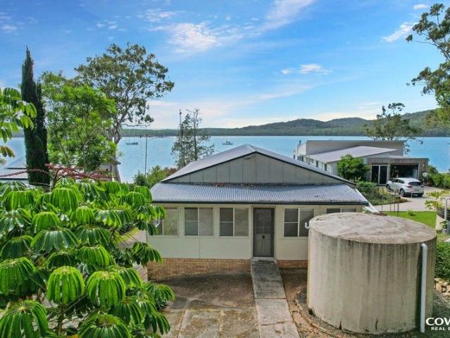 Absolute Waterfront on the Pristine Waters of North Arm Cove | Private Boat Ramp & Dual Dwelling Potential