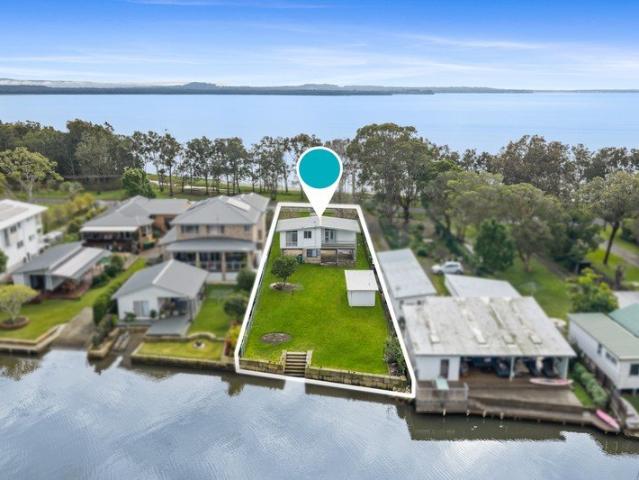 Absolute Waterfront Original Pole Home on 1,196sqm